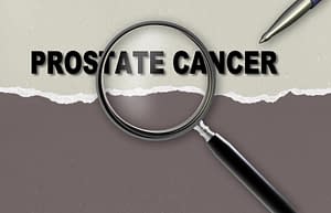 word  prostate cancer   and magnifying glass with pensil made in 2d software